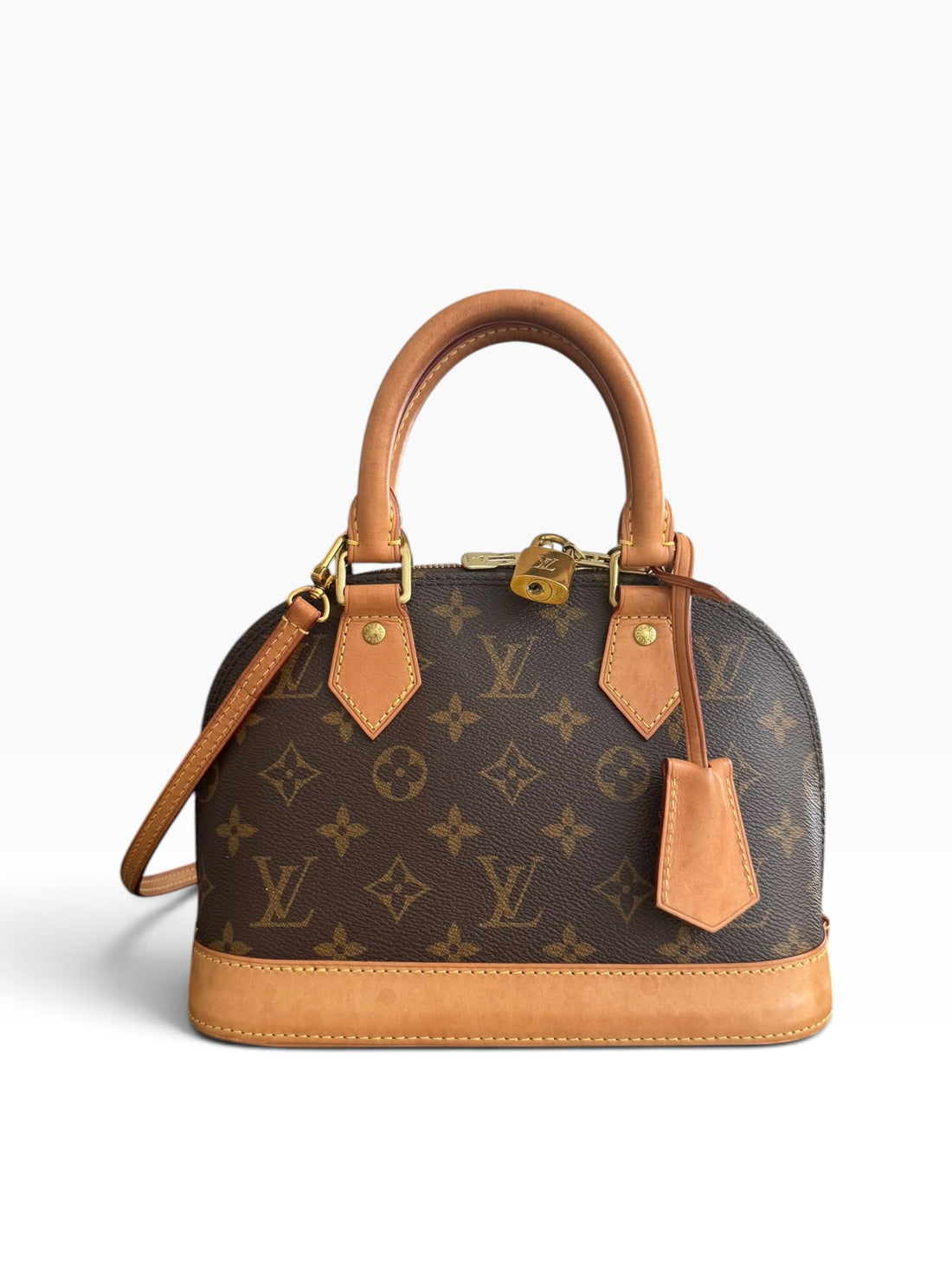 Louis Vuitton Alma BB en toile Monogram avec bandoulière amovible. Toile Monogram enduite.