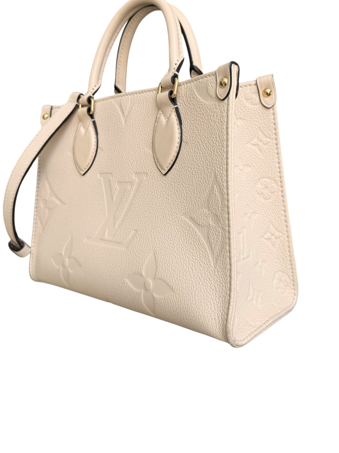 Louis Vuitton On-The-Go PM in Monogram Empreinte Leder in der Farbe creme mit abnehmbaren und verstellbaren Schulterriemen.