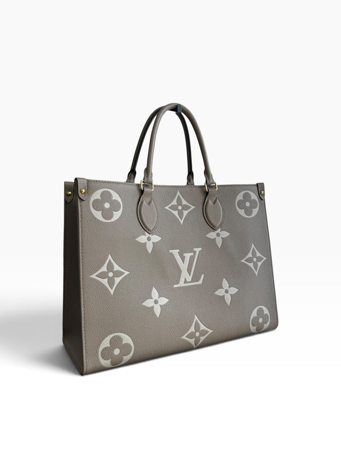 Louis Vuitton On-The-Go MM in Empreinte Leder in der Farbe Tourterelle / Beige Beige.