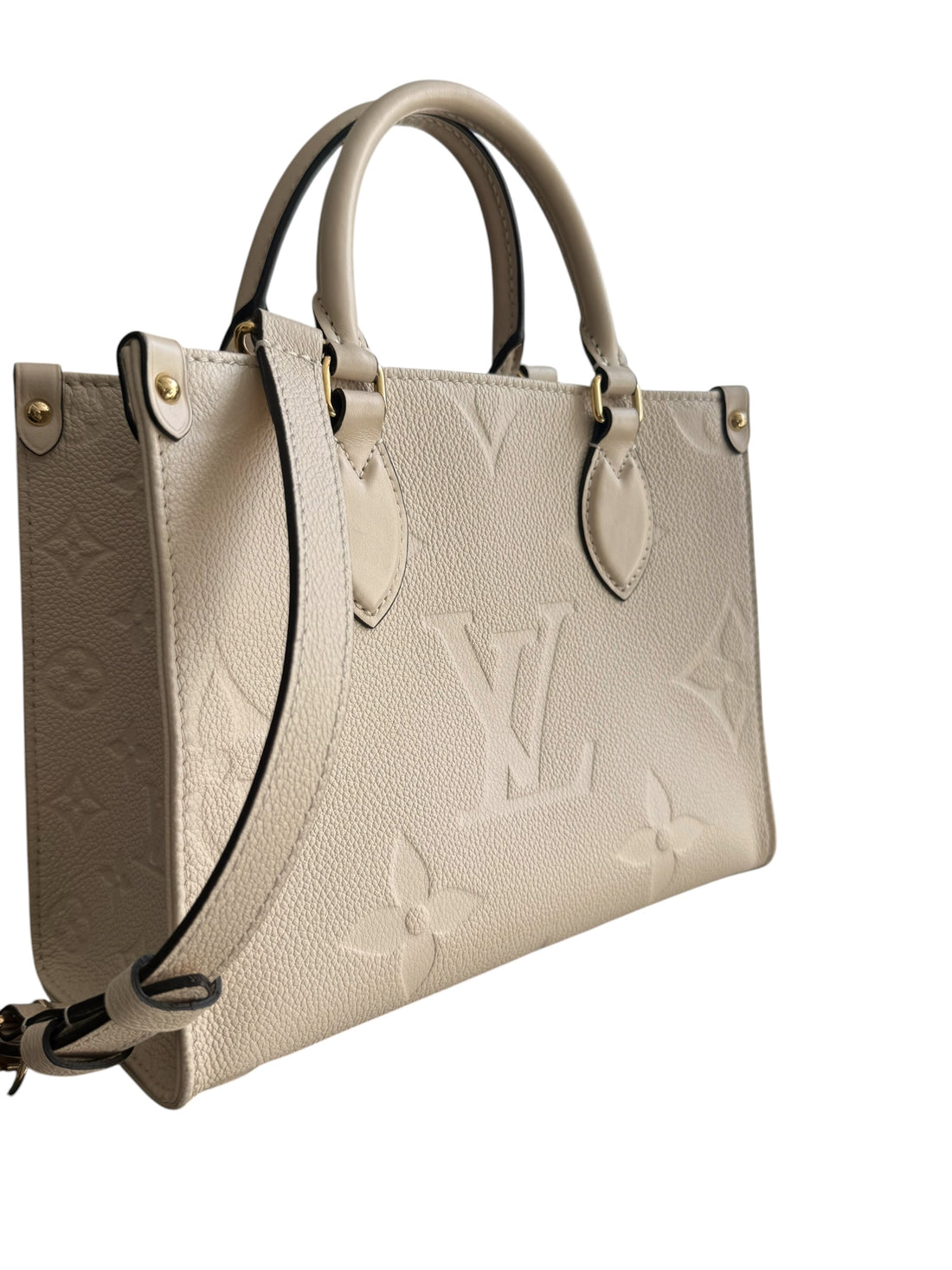 Louis Vuitton On-The-Go PM in Monogram Empreinte Leder in der Farbe creme mit abnehmbaren und verstellbaren Schulterriemen.