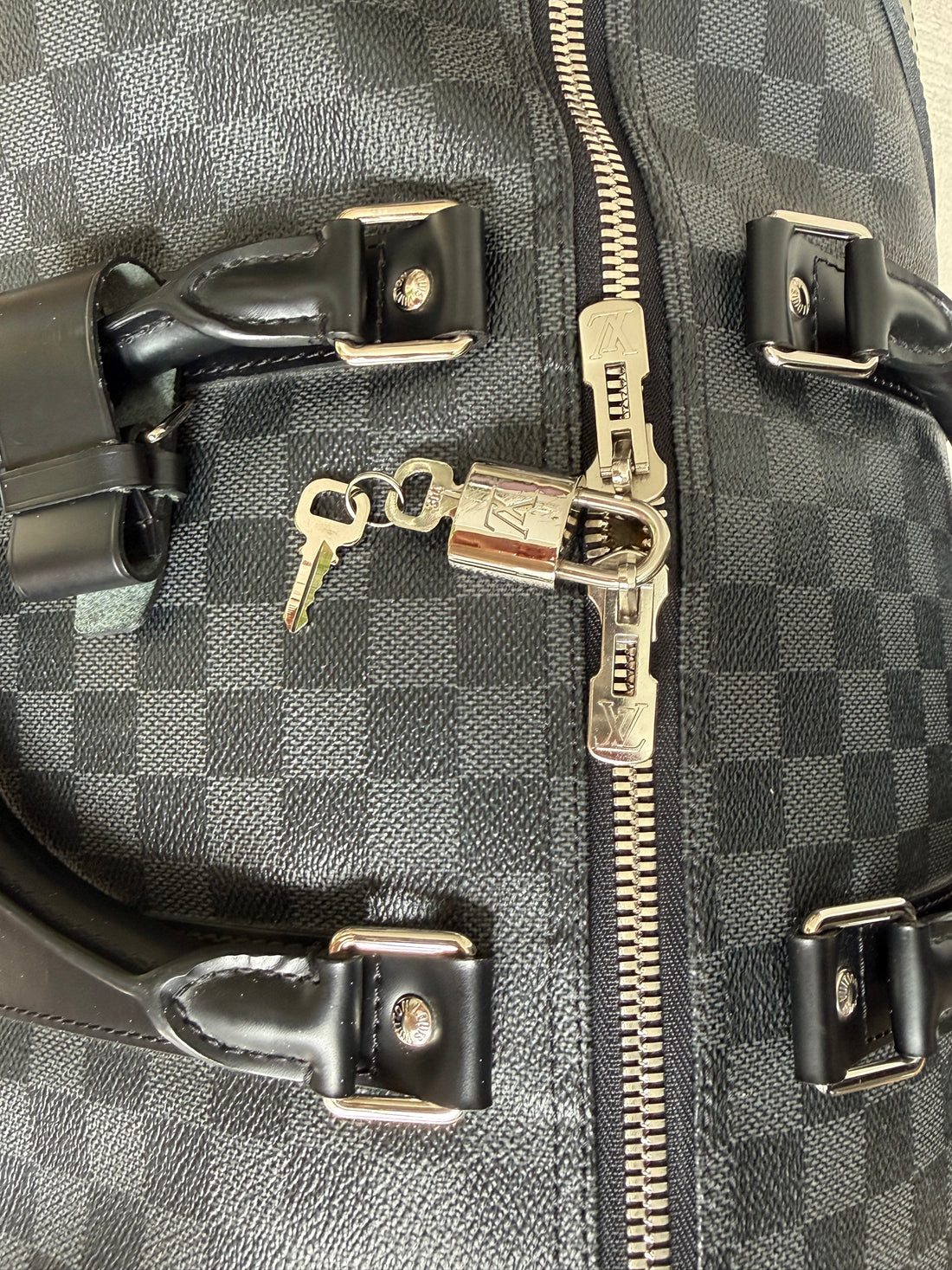 Louis Vuitton Keepall 55 in Damier Graphite Canvas.